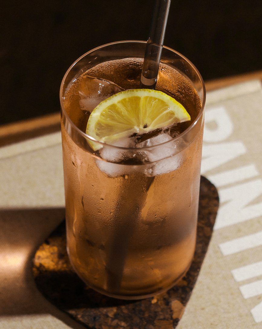 Iced drink with lemon  in a tall glass #clear
